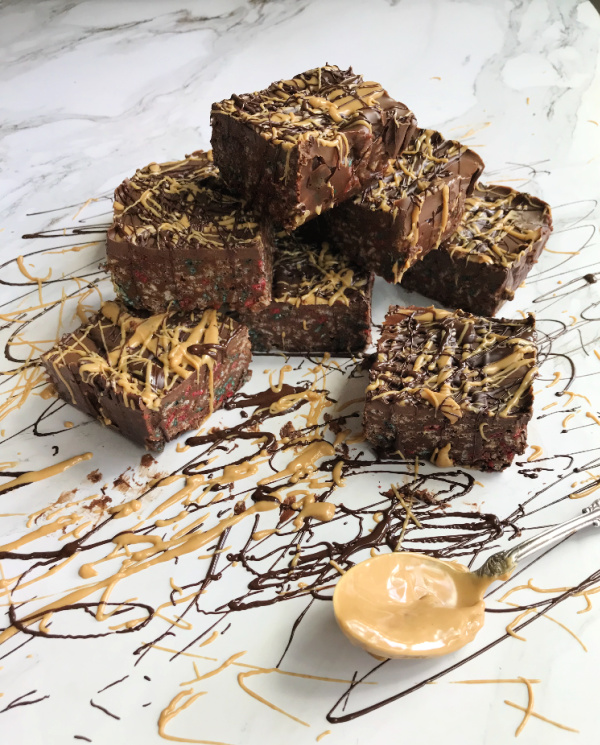 chocolate peanut butter Rice Krispie Treats with chocolate and peanut butter drizzle