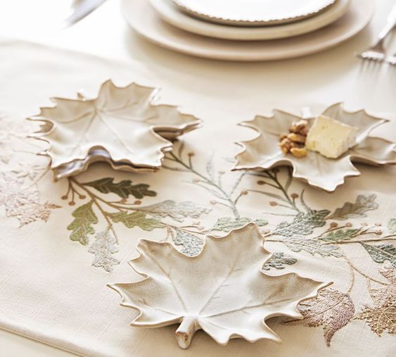 Cosy fall finds pottery barn leaf plates for appetizers on a leaf table runner