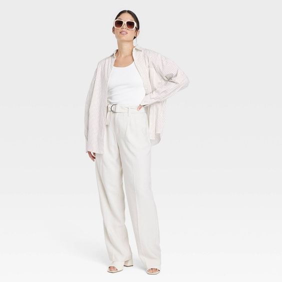 Friday Favorites woman wearing white pants white t-shirt and a white and gray stripped shirt