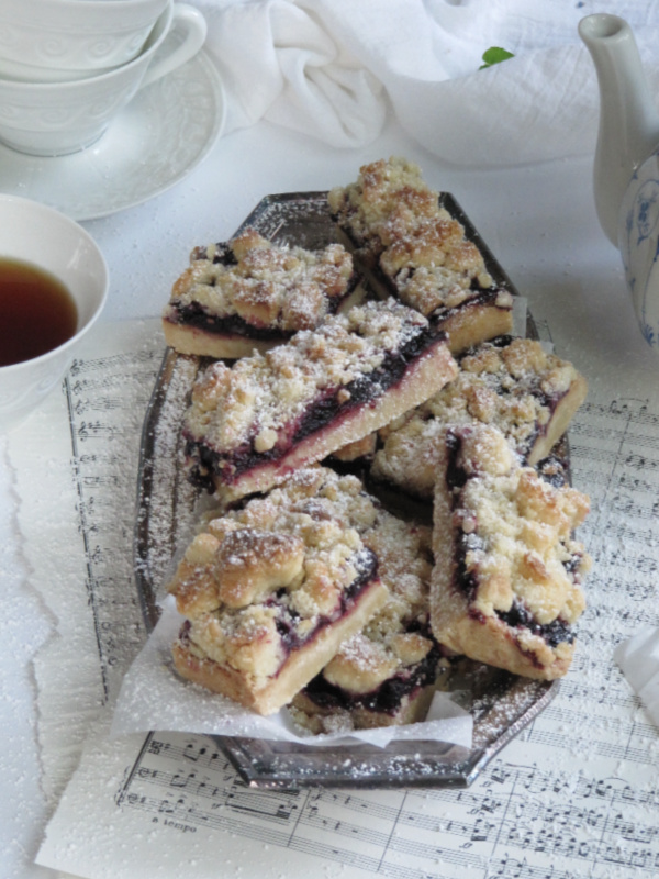 roasted cherry streusel bars on silver tray