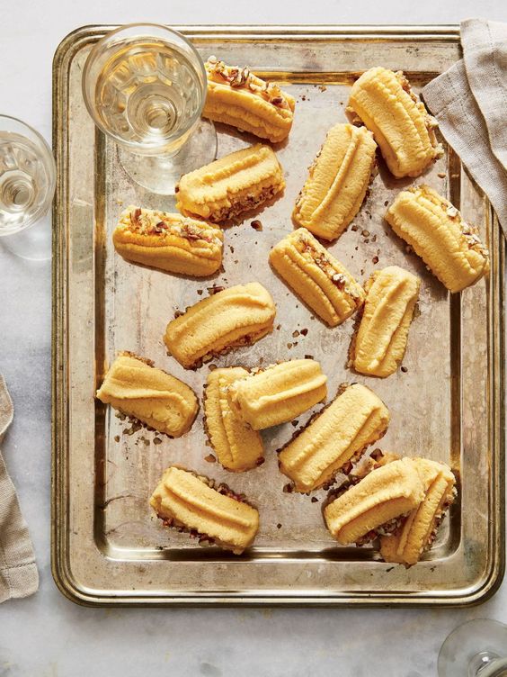 pimento cheese straws on a silver tray