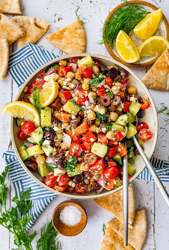 large white bowl filled with greek chickpea salad