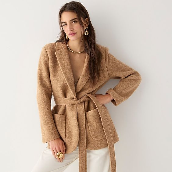 woman wearing a camel collared belted sweater J Crew