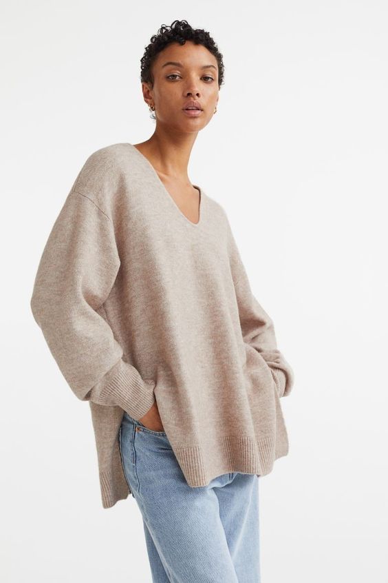 woman wearing a tan oversized sweater