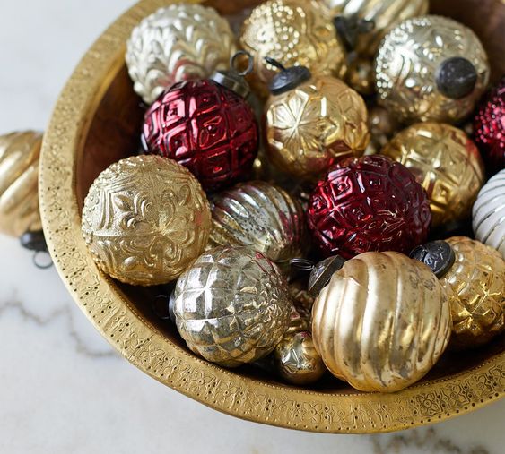 wood bowl of red gold and silver mercury glass ornaments