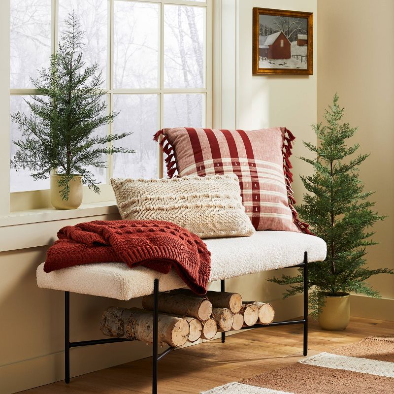 Studio McGee Christmas with Target pillows on a bench with christmas trees. 