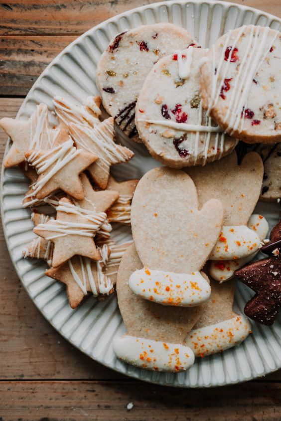 shortbread cookies four ways on a white plate.