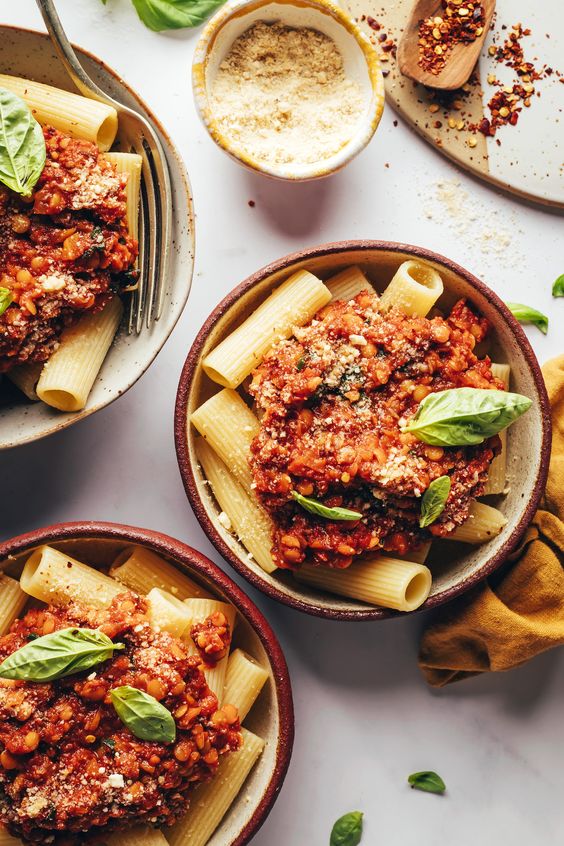 Vegan Bolognese with Mushrooms & Red Lentils in three bowls. 