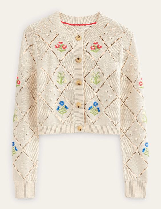White sweater with embroidered flowers