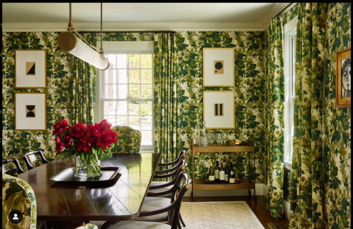 Collected decor, dining room with green wallpaper.