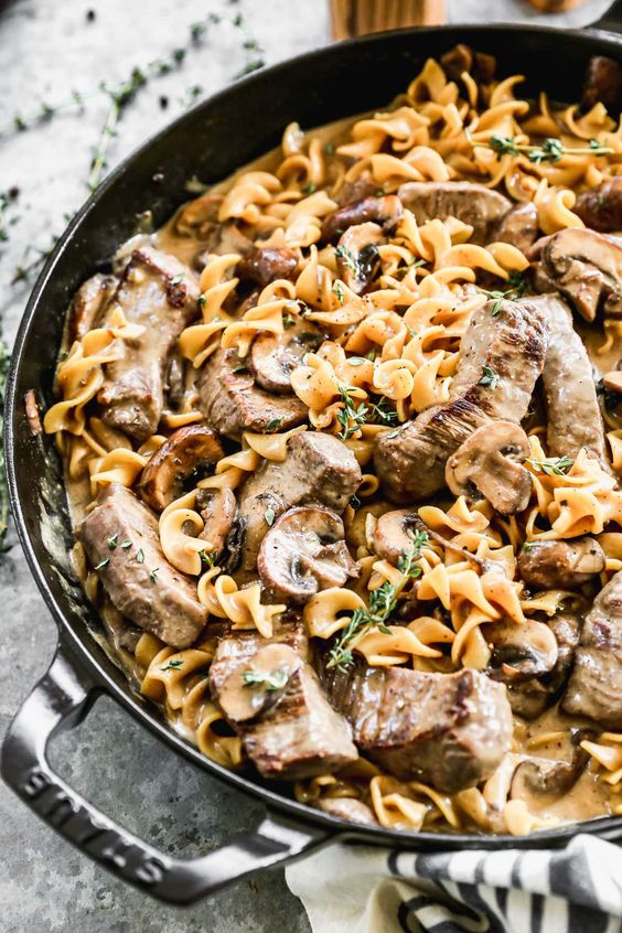 Beef Stroganoff in a cast iron skillet.