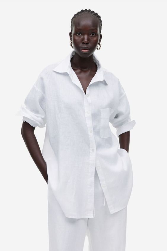 Woman in white linen shirt and pants