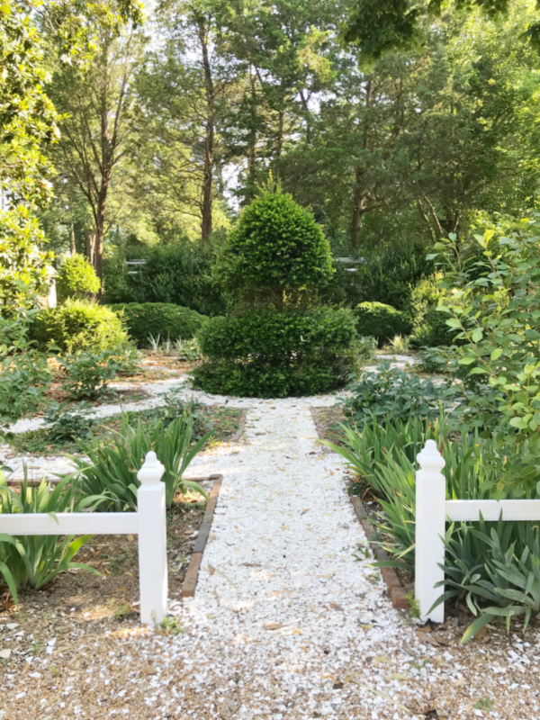 Throughout House Garden with white pe gravel stone path.
