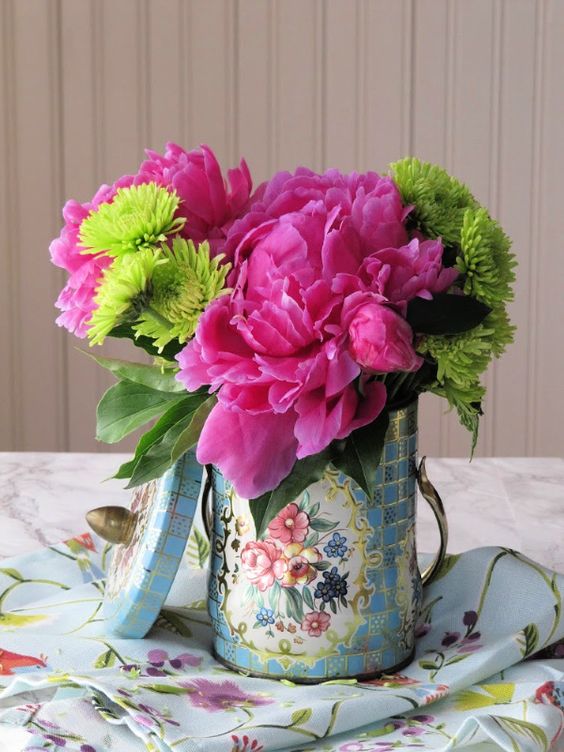 Mother's Day flowers in vintage containers, pink and green. flowers a 
