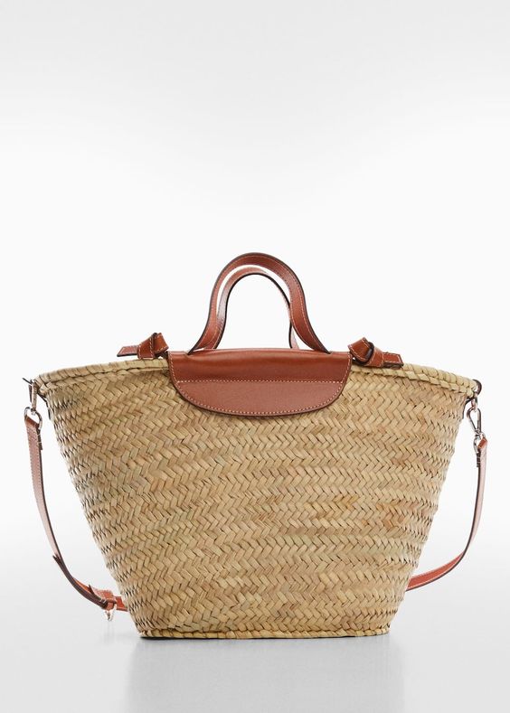 wicker tote with leather trim and shoulder strap. 