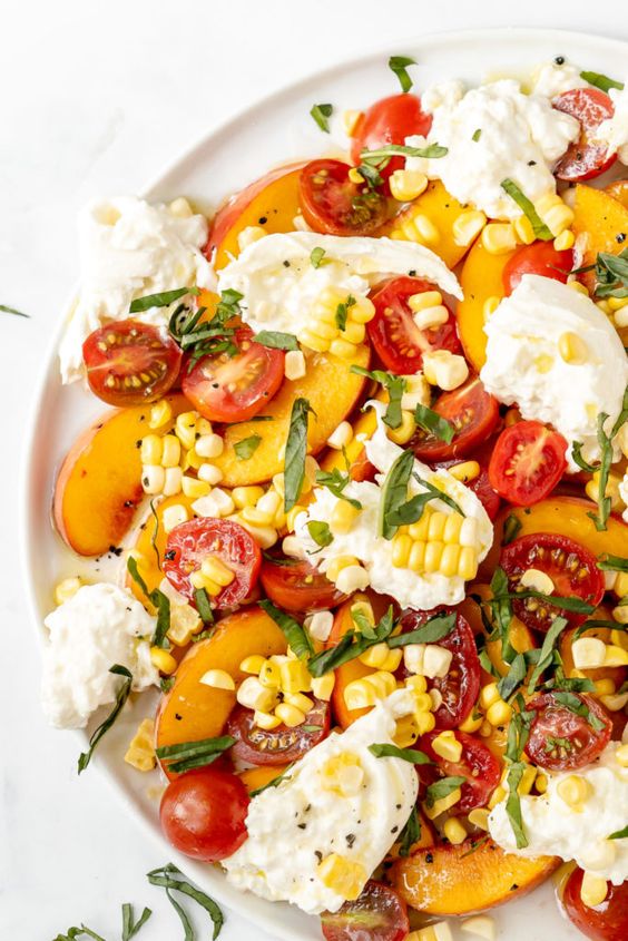 Peach, corn and burrata cheese salad. 