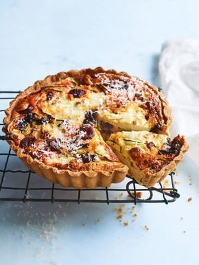 A zucchini chorizo quiche cooling on a wire rack.