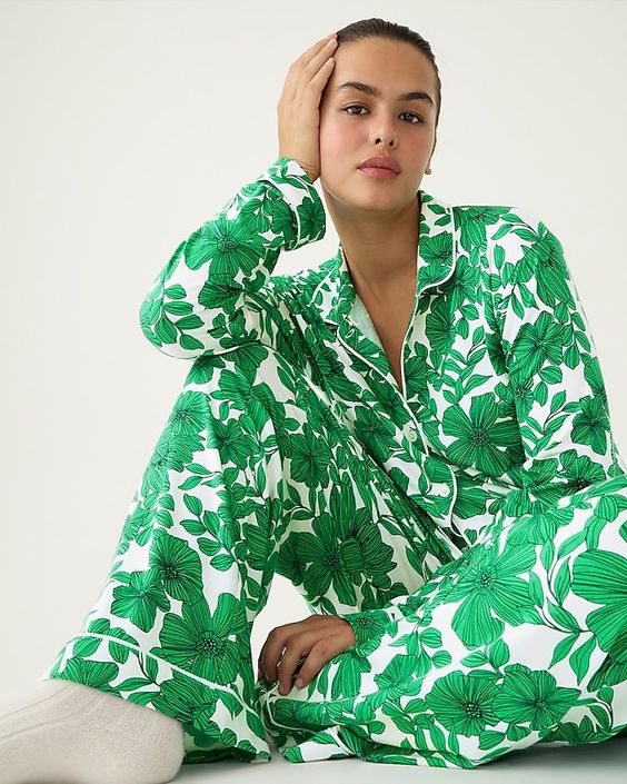 A woman wearing a pair of green and white pjs. 