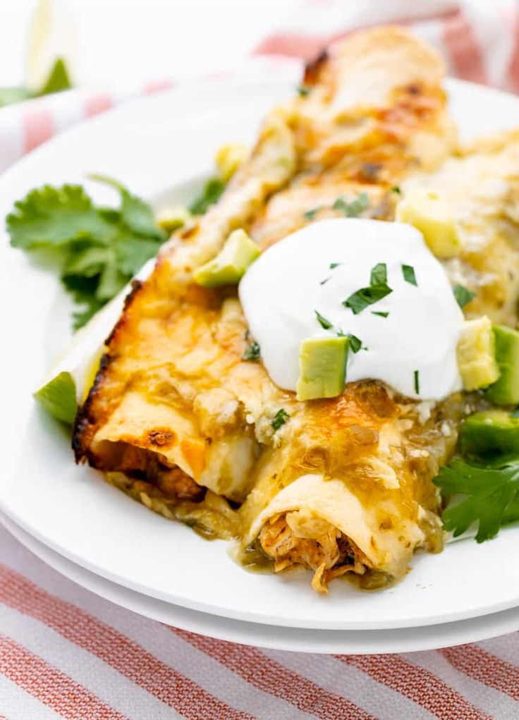 Friday Favorites Chicken Enchiladas made with Green Chiles.