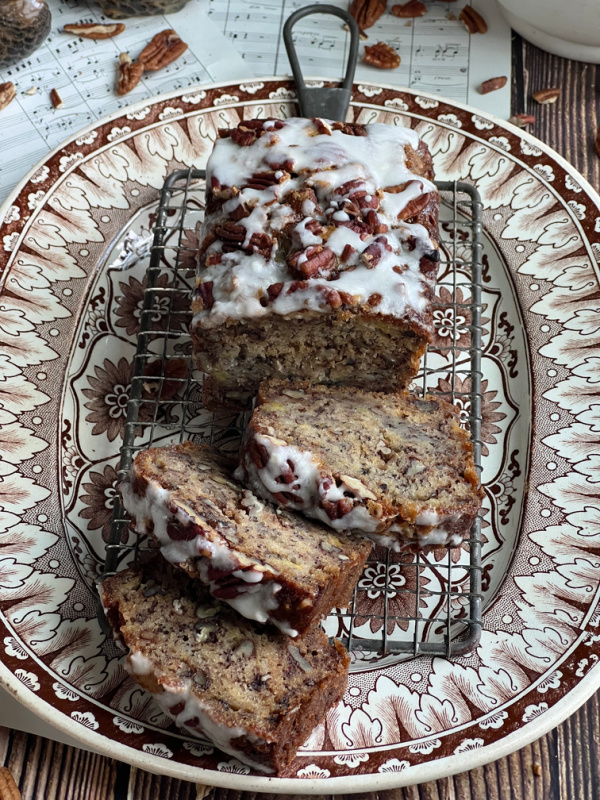 chai spice zucchini bread sliced on transfer ware platter.