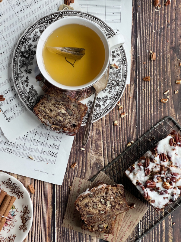 cup of tea and sliced chai zucchini loaf cake.