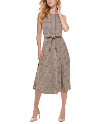 Woman wearing a plaid dress. 