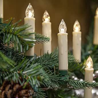 English Country Cottage Christmas decor with tartan plaid, fairy lights, holly, Christmas crackers, orange pomanders and more on Pinecones & Acorns lifestyle blog.