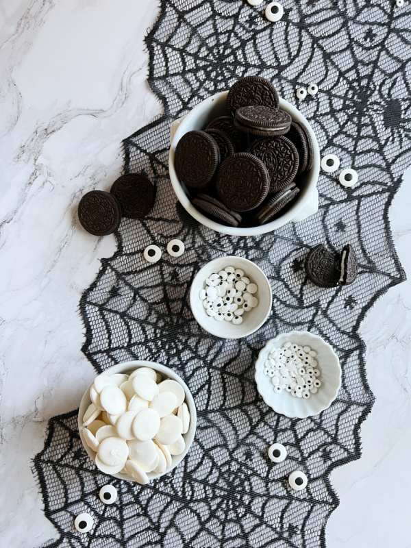 No-Bake Mummy Cookies ingredients, white chocolate, Oreos and candy eyes. 