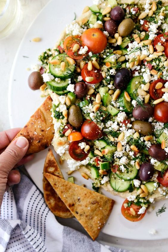 7-LAYER LOADED HUMMUS DIP. 
