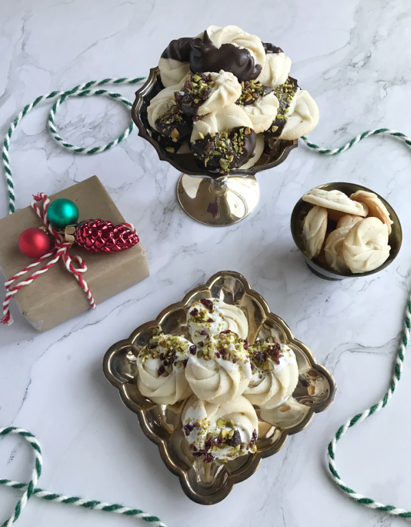 chocolate dipped Viennese Whirl Cookies on silver plates.