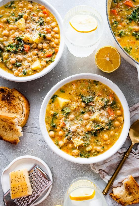 2 white bowls of chickpea soup. 