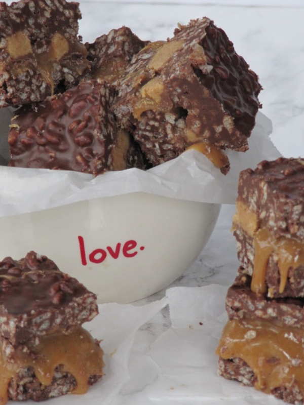 Dark-chocolate-caramel-stuffed peanut butter krispie bars.