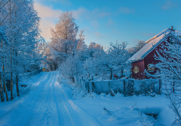 11 Ways to Beat the Winter Blues, a red barn on a snowy lane.