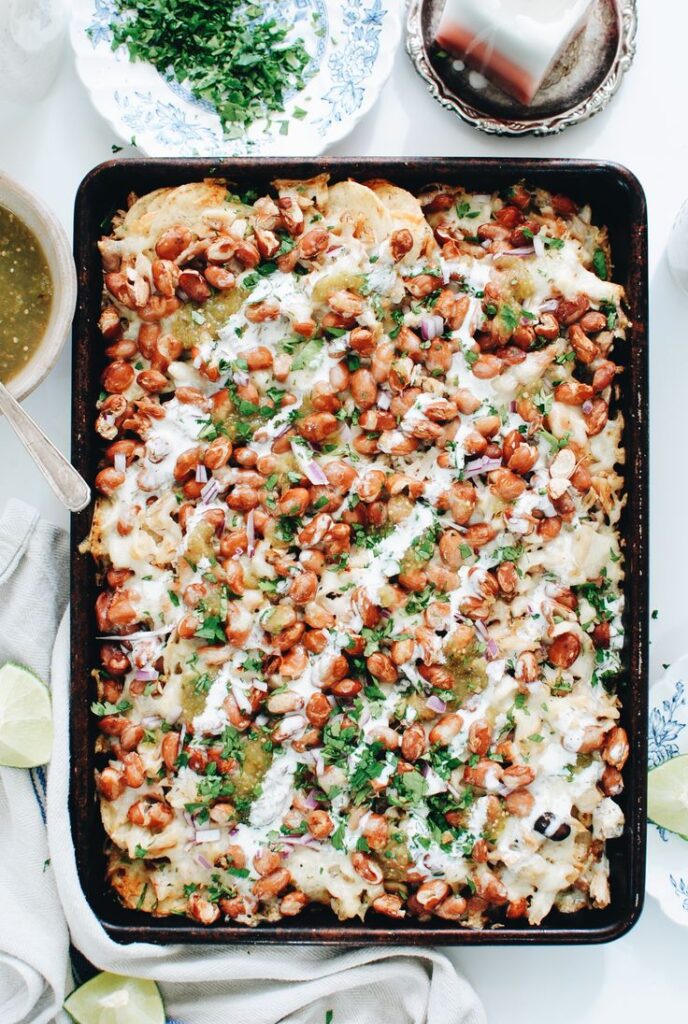 sheet pan of chicken nachos. 
