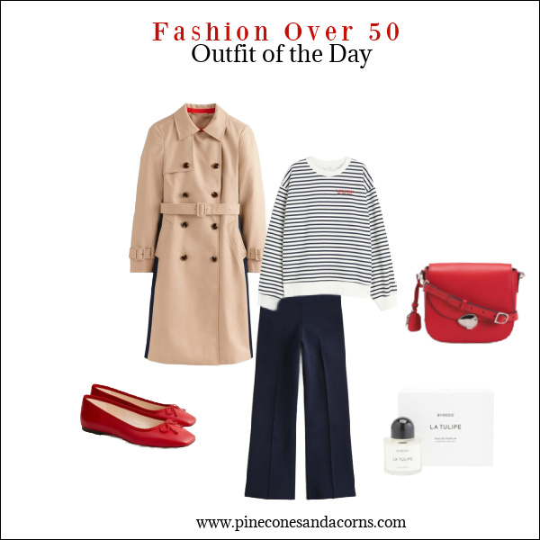 Fashion over 50 outfit with blue pants, blue and white shirt, trench and red ballet flats.