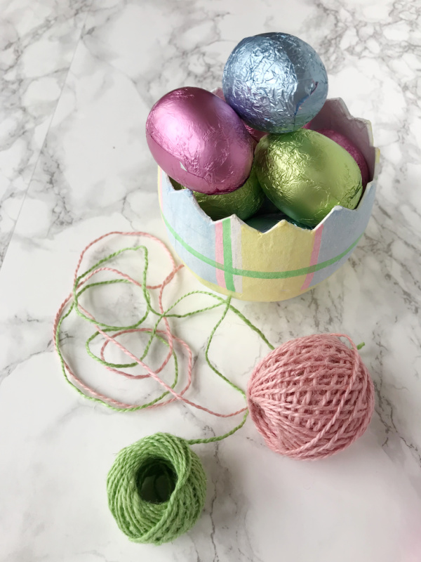 Chocolate Foil Easter eggs in a paper cache egg with pink and green twine.