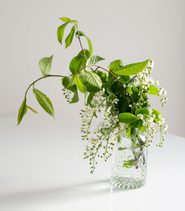 white blossoms in a clear glass vase.