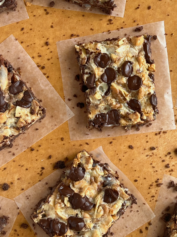 Hello Dolly Seven Layer Brownie Bars with chocolate chips, coconut, brownie layer and butterscotch chips. 