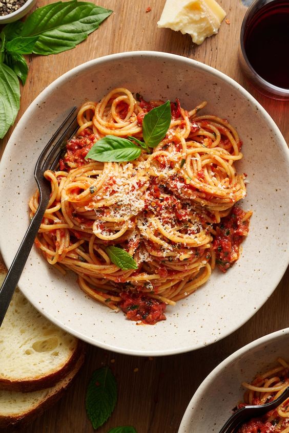 Simple Spaghetti Fra Diavolo in an off white bowl with a fork.
