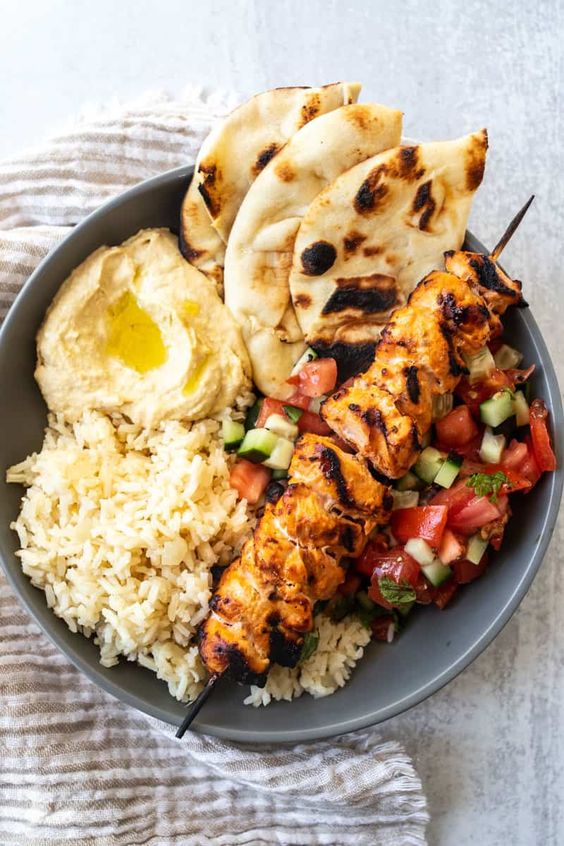 Mediterranean Rice Bowl with Grilled Chicken Tawook Skewers
