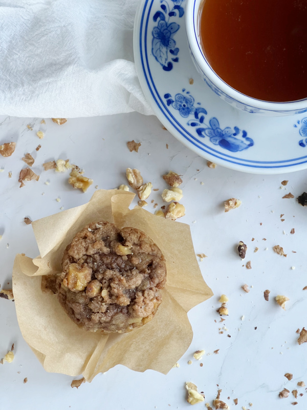 Banana Nut Muffins with Streusel and a blue and white tea cup