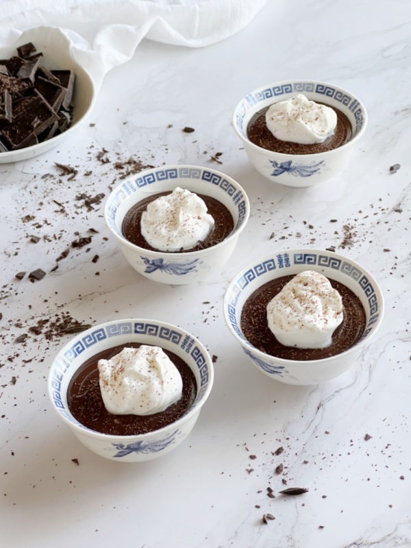 Homemade Double Chocolate Pudding in blue and white cups.