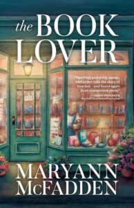 Book cover of the Book Lover, looking into a set of green painted doors at the inside of a book store. 