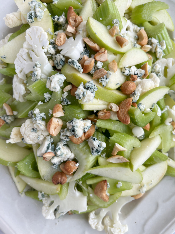 Celery Apple Cauliflower Green salad with blue cheese and chopped cashews.