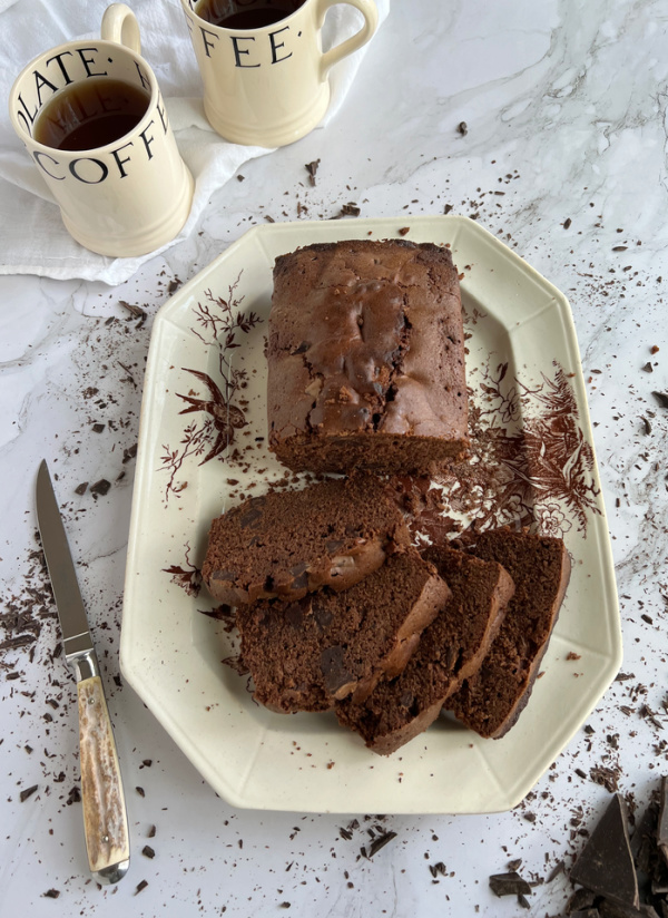 Chocolate loaf cake and 2 cups of coffee in Emma Bridgewater mugs