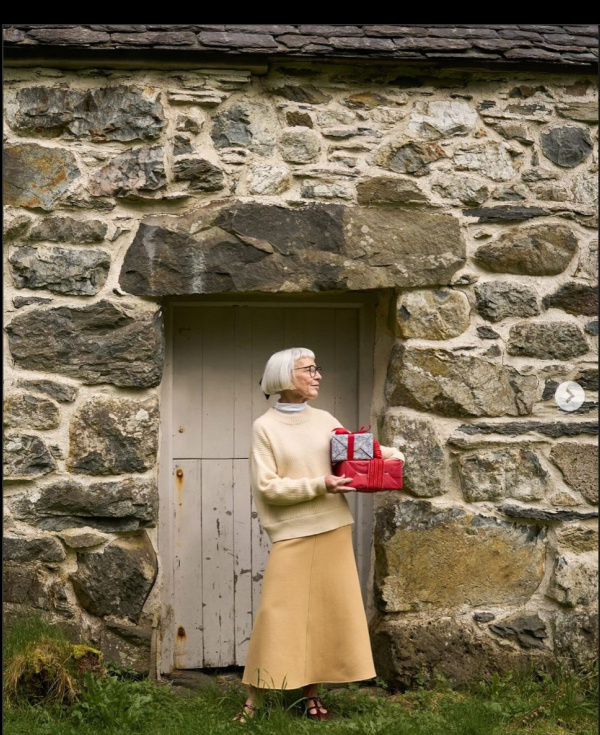 Woman in a yellow skirt and shirt crew ad. 