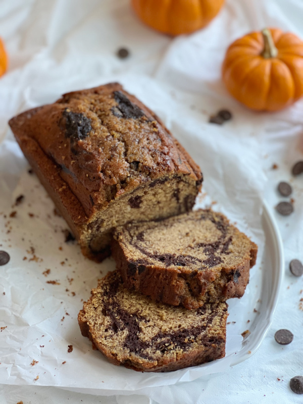 chocolate pumpkin marble bread on a white platter.