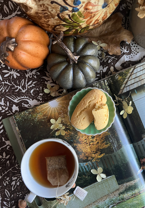 cup of tea and cookies fall flatlay