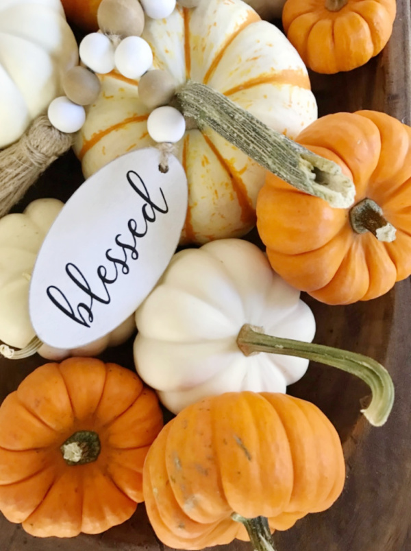 Pile of pumpkins with a blessed tag.