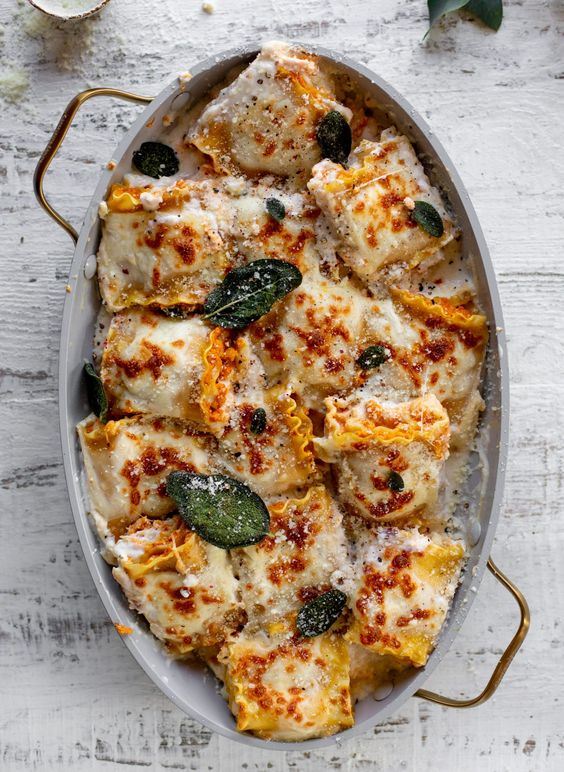 pumpkin lasagna roll-up in a casserole pan. 